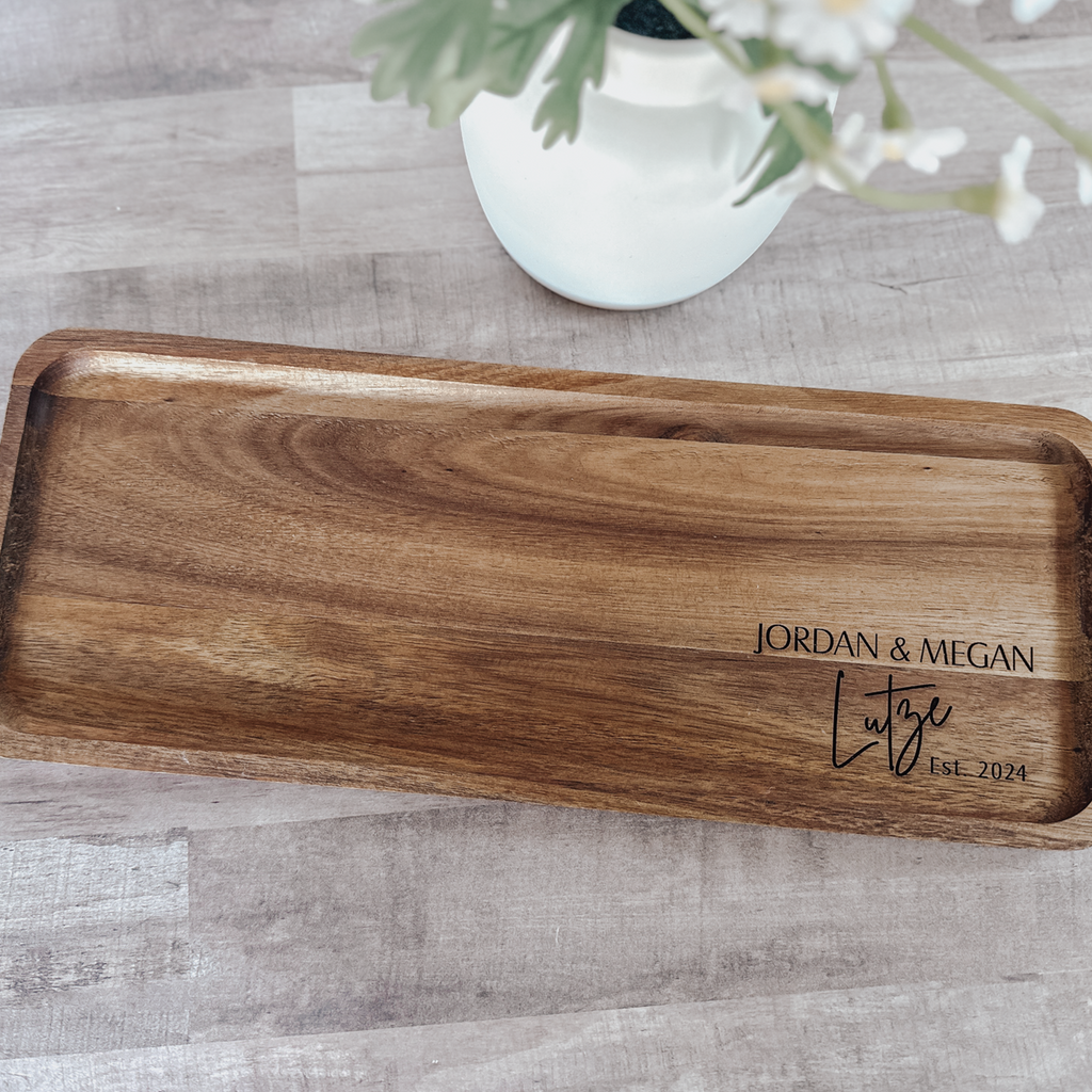 Top-down view of personalized acacia wood serving tray with custom engraving
